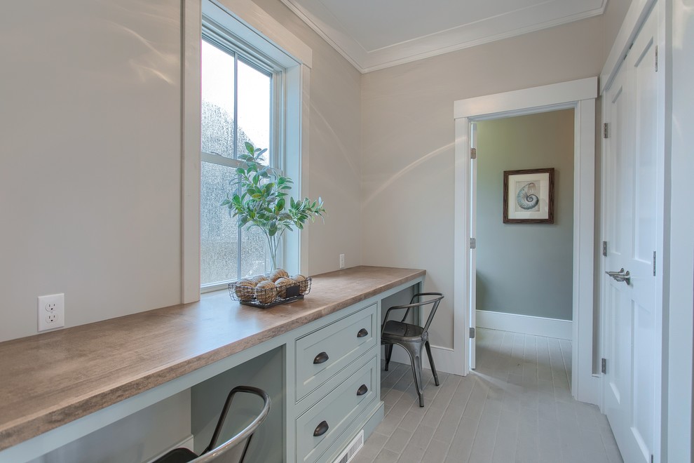 Photo of a mid-sized country mudroom in Boston with grey walls, ceramic floors, grey floor, a single front door and a white front door.