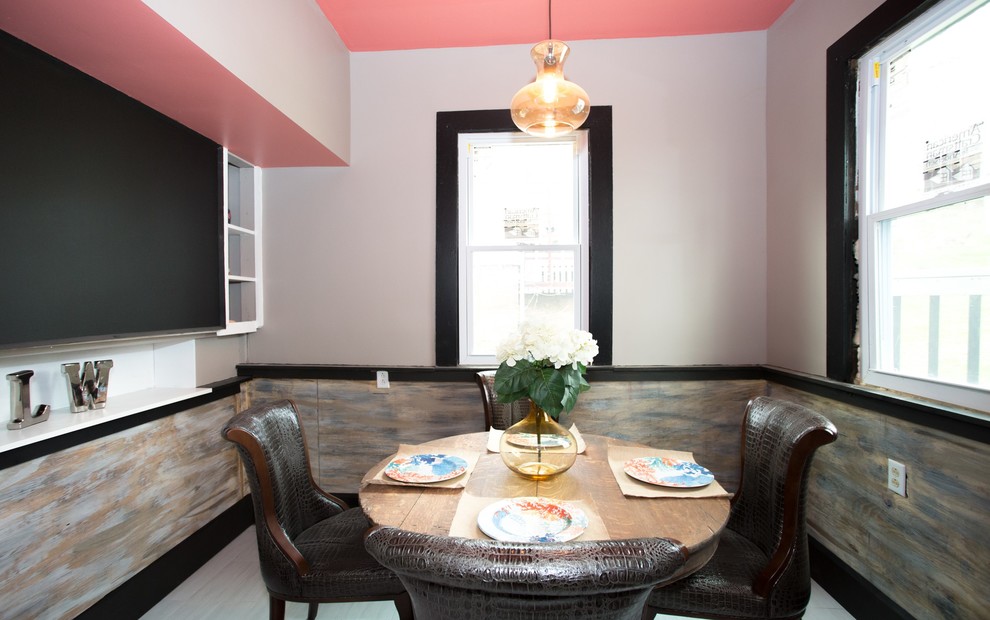 Example of a small transitional l-shaped vinyl floor and white floor enclosed dining room design with a double-bowl sink, recessed-panel cabinets, black cabinets, laminate countertops, white backsplash, subway tile backsplash, stainless steel appliances and gray countertops