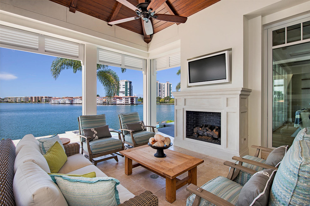 Mid-sized transitional backyard tile patio photo in Miami with a roof extension