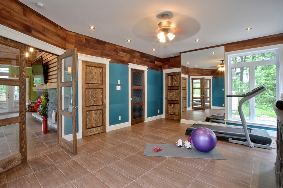 Traditional home gym in Montreal with blue walls.