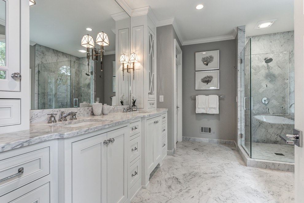 Traditional master bathroom in Atlanta with an undermount sink, recessed-panel cabinets, white cabinets, a corner shower and grey walls.