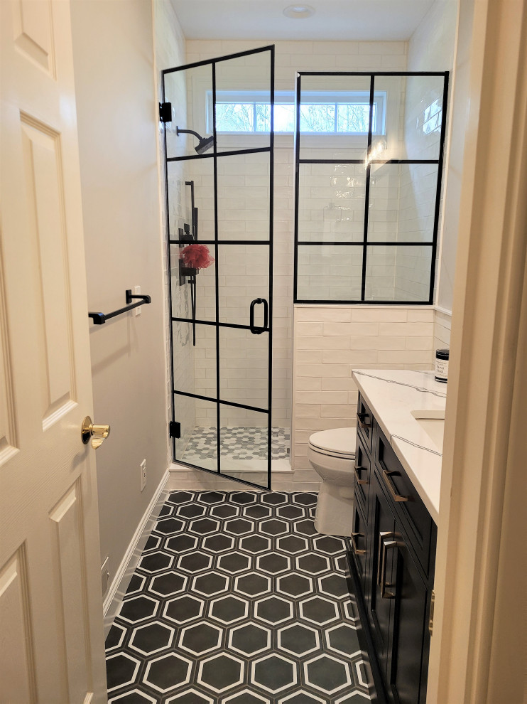 Small traditional shower room bathroom in Boston with beaded cabinets, black cabinets, an alcove shower, a two-piece toilet, white tiles, ceramic tiles, grey walls, porcelain flooring, a vessel sink, engineered stone worktops, black floors, a hinged door, white worktops, a shower bench, a single sink and a floating vanity unit.