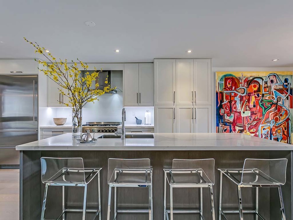 Example of a transitional kitchen design in Toronto
