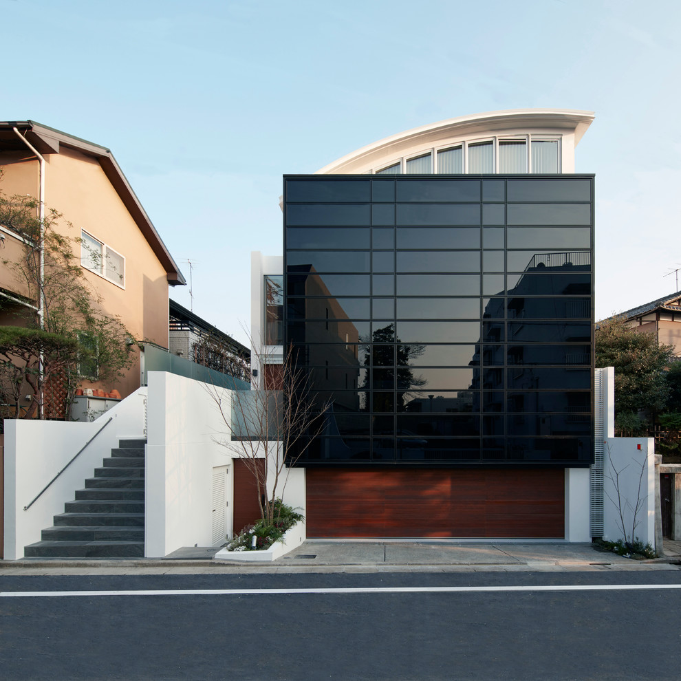 Design ideas for a large modern three-storey glass brown exterior in Tokyo.