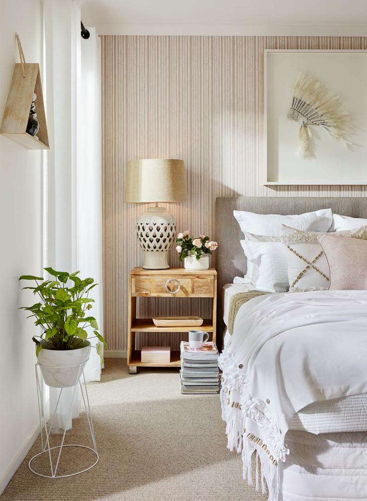 Inspiration for a transitional bedroom in Melbourne with beige walls and carpet.