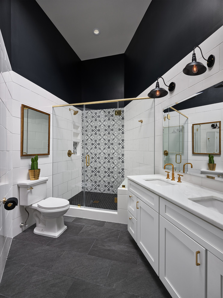Design ideas for a large transitional 3/4 bathroom in DC Metro with shaker cabinets, white cabinets, white tile, black and white tile, an undermount sink, a hinged shower door, cement tile, a corner shower, a two-piece toilet, black walls, slate floors, marble benchtops and black floor.