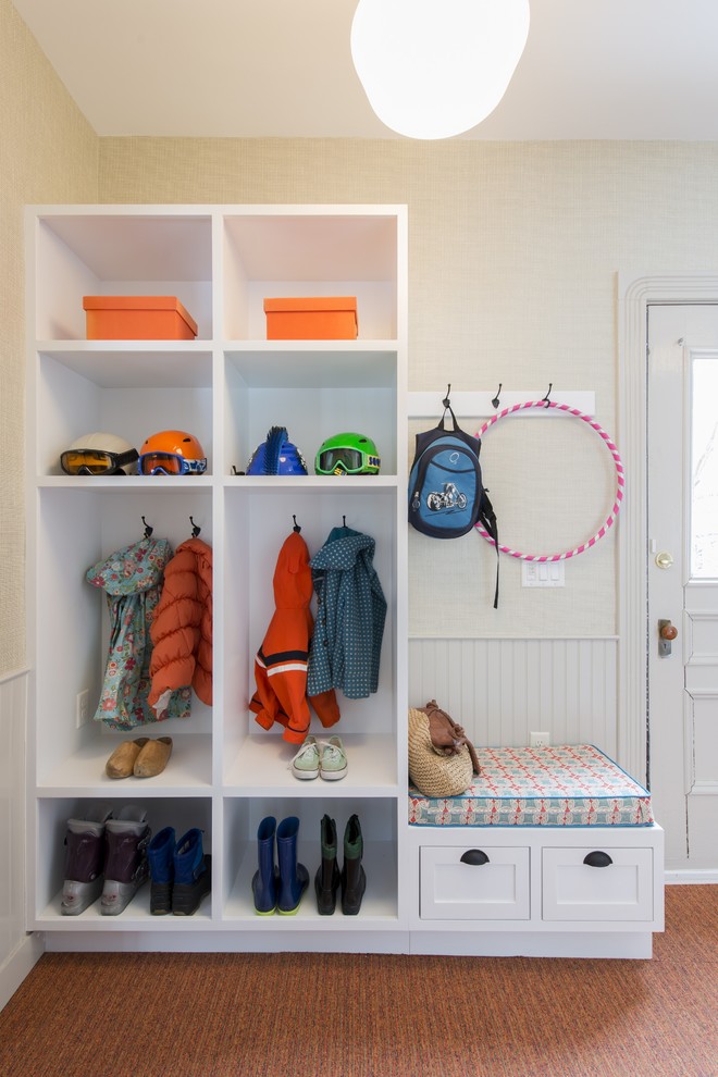 Photo of a mid-sized traditional mudroom in Other with beige walls, carpet, a single front door, a white front door and orange floor.