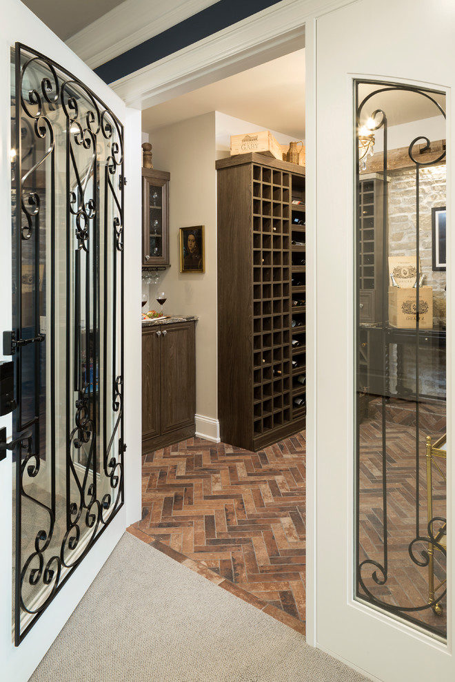 Design ideas for a mid-sized traditional wine cellar in Minneapolis with brick floors, storage racks and red floor.