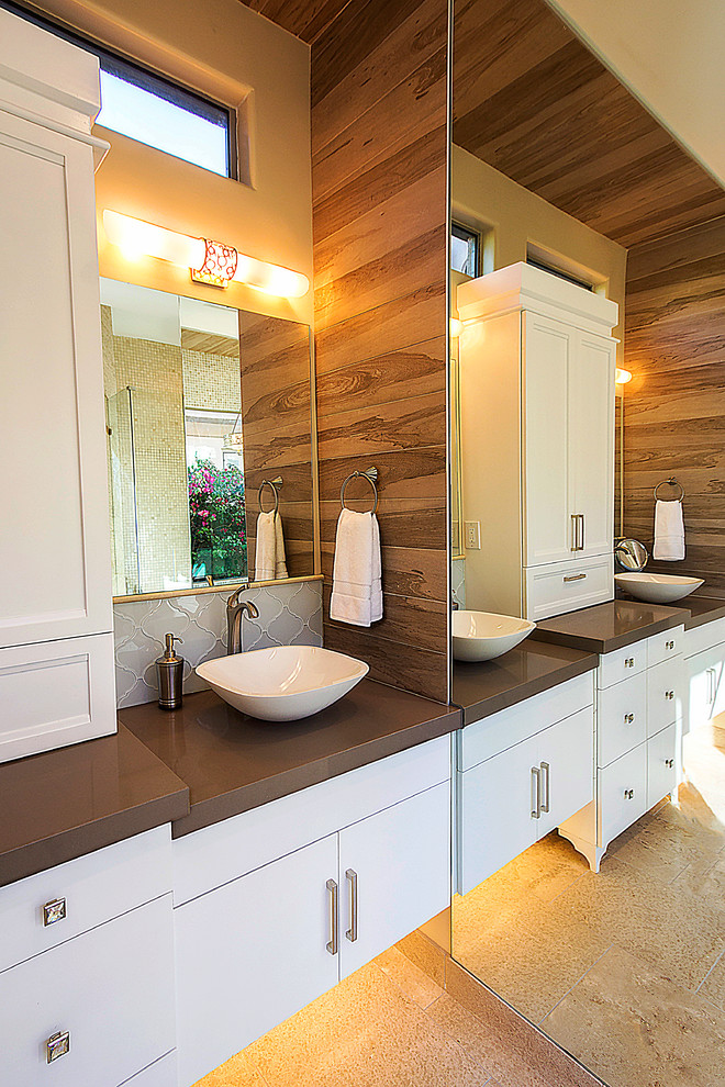 Photo of a mid-sized transitional 3/4 bathroom in Other with a vessel sink, flat-panel cabinets, quartzite benchtops, an undermount tub, a curbless shower, beige tile, matchstick tile, beige walls, travertine floors and white cabinets.