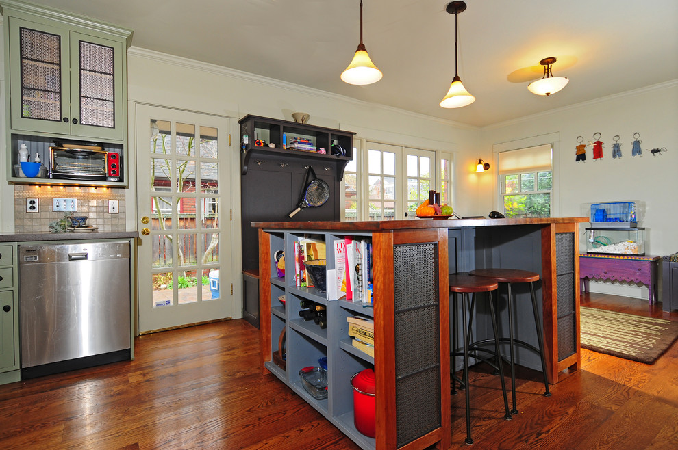 Kitchen pantry - mid-sized transitional u-shaped dark wood floor kitchen pantry idea in Seattle with a farmhouse sink, shaker cabinets, green cabinets, concrete countertops, green backsplash, stone tile backsplash, stainless steel appliances, gray walls and an island