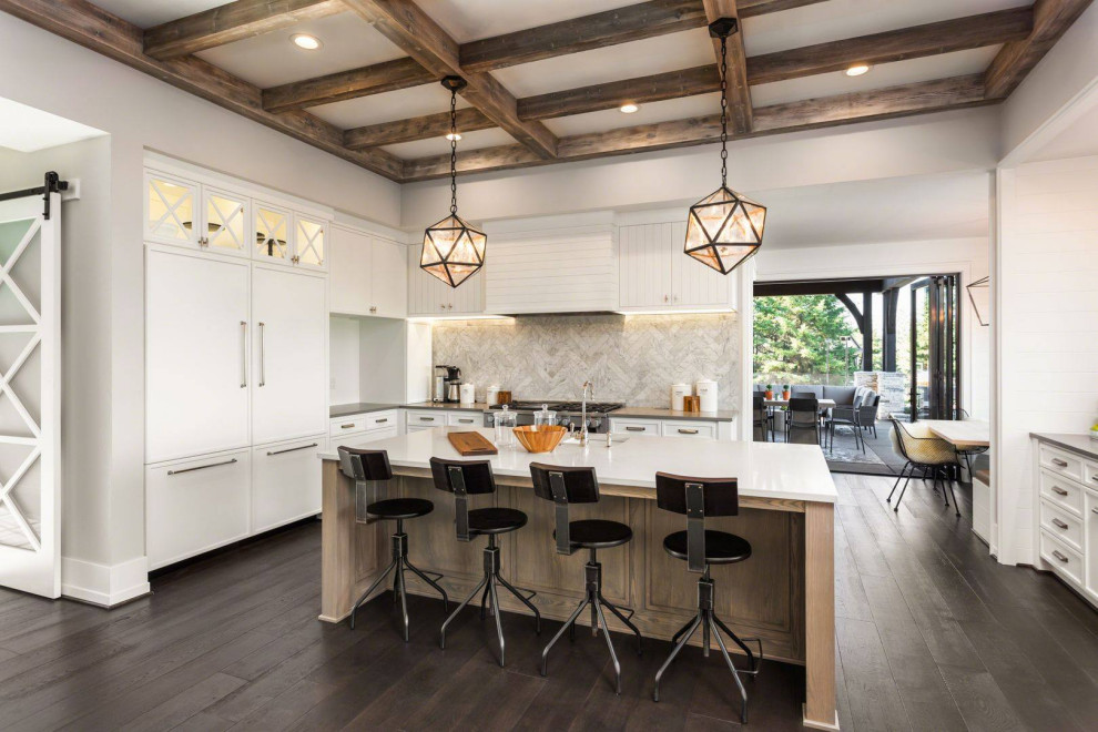 Large midcentury u-shaped eat-in kitchen in Los Angeles with a drop-in sink, flat-panel cabinets, white cabinets, quartzite benchtops, white splashback, marble splashback, black appliances, dark hardwood floors, with island, brown floor, multi-coloured benchtop and coffered.