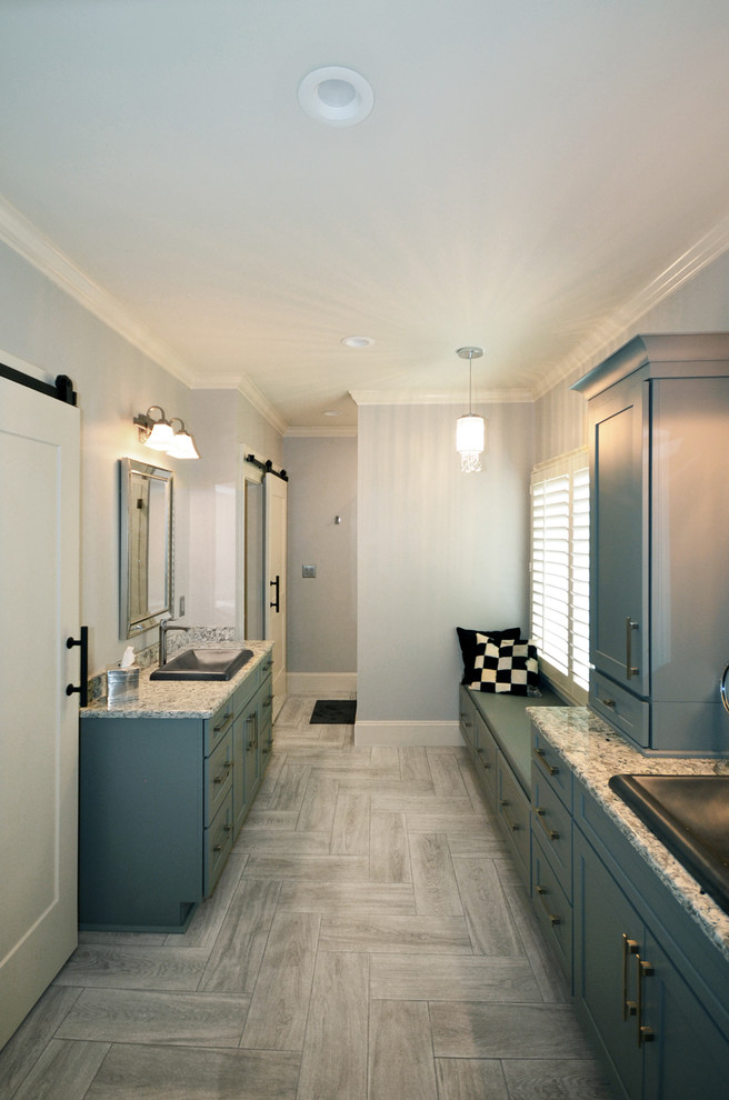 Inspiration for a mid-sized country master bathroom in Charlotte with shaker cabinets, grey cabinets, gray tile, porcelain tile, porcelain floors, a drop-in sink, engineered quartz benchtops, grey floor and grey benchtops.