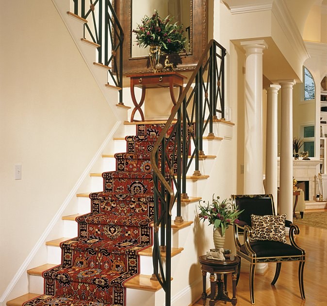 Inspiration for a mid-sized traditional wood u-shaped staircase in Orange County with painted wood risers.