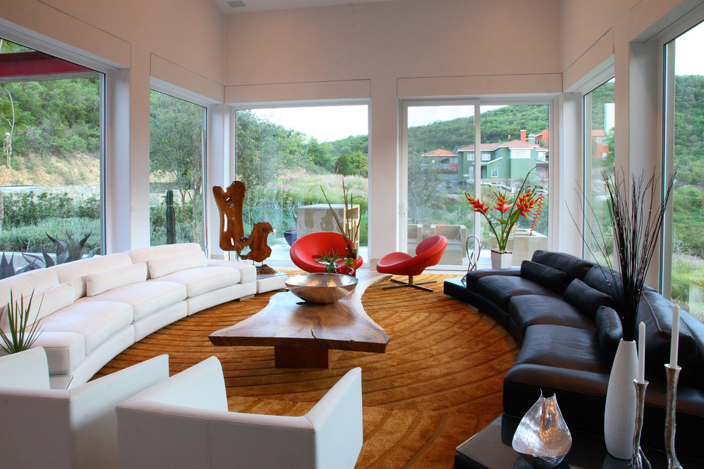 This is an example of a large contemporary living room in Other with white walls.