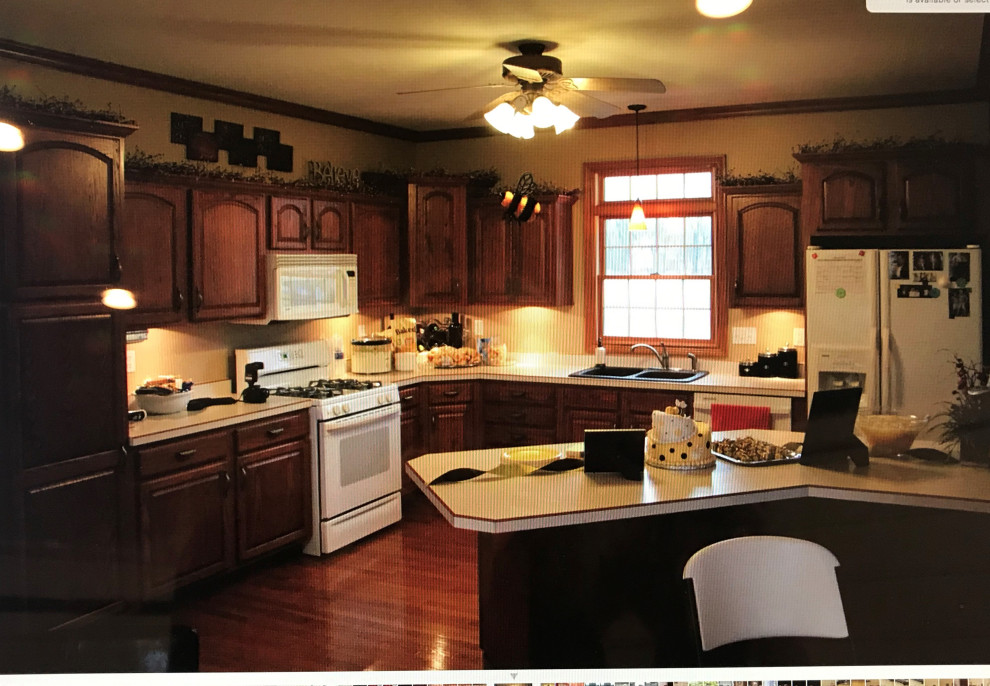 Open concept kitchen - large transitional l-shaped medium tone wood floor and brown floor open concept kitchen idea with an undermount sink, flat-panel cabinets, white cabinets, quartz countertops, multicolored backsplash, quartz backsplash, black appliances, an island and multicolored countertops