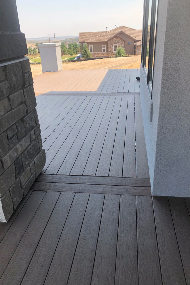 Example of a large backyard second story deck design with no cover
