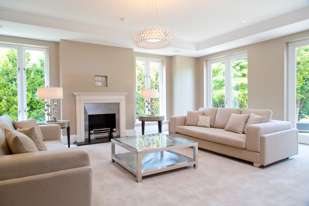Inspiration for a mid-sized transitional formal living room in Cheshire with beige walls, carpet, a standard fireplace and a metal fireplace surround.