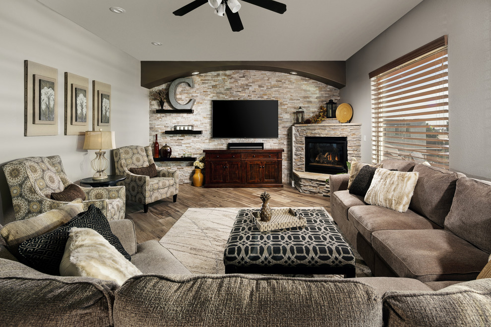 Example of a large transitional l-shaped porcelain tile and brown floor eat-in kitchen design in Orlando with an undermount sink, raised-panel cabinets, beige cabinets, quartz countertops, multicolored backsplash, travertine backsplash, stainless steel appliances, an island and multicolored countertops