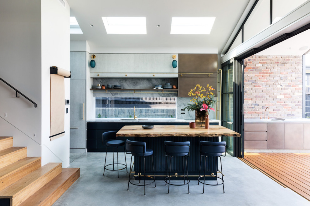 Inspiration for a contemporary galley kitchen in Sydney with marble benchtops, grey splashback, marble splashback, concrete floors, with island, grey floor, multi-coloured benchtop, an undermount sink, flat-panel cabinets and grey cabinets.