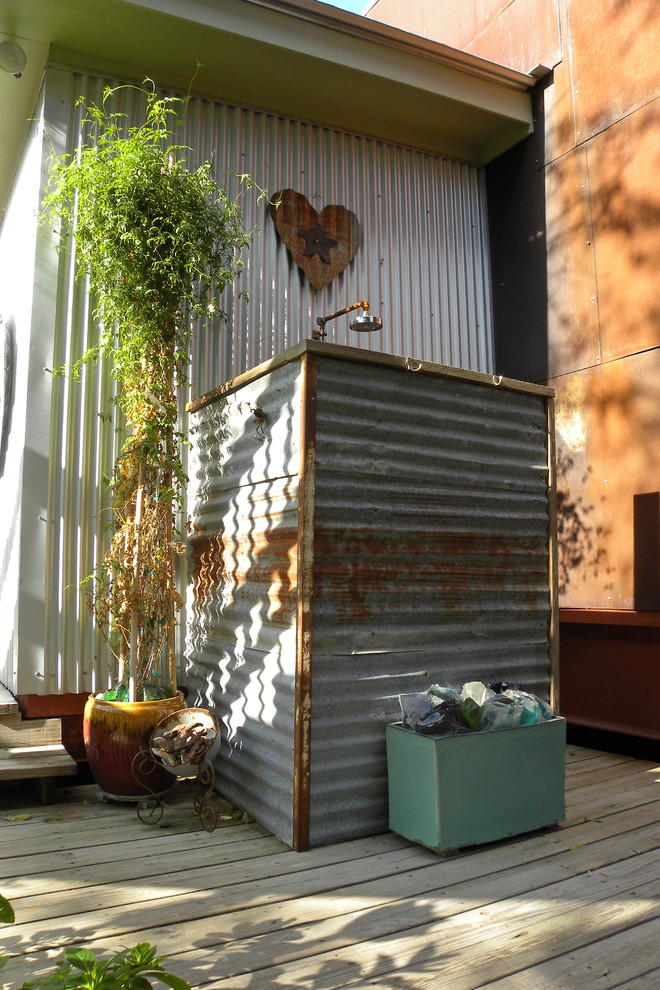 Inspiration for an industrial patio in Dallas with an outdoor shower.