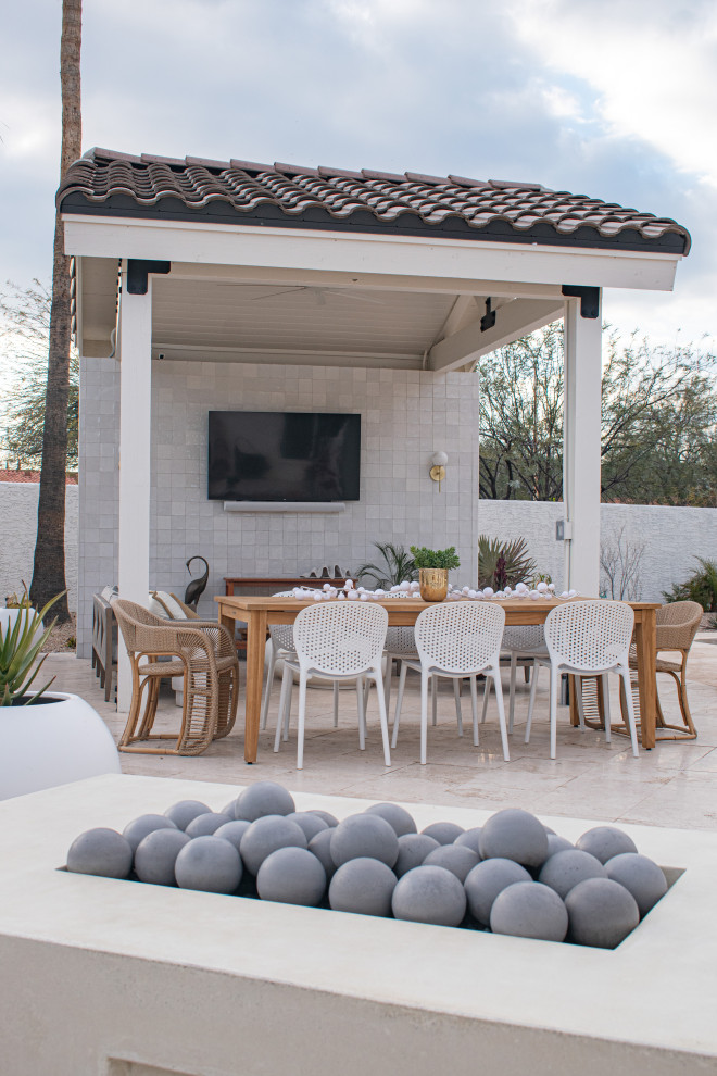 Inspiration for a medium sized contemporary back patio in Phoenix with a fire feature, brick paving and a pergola.