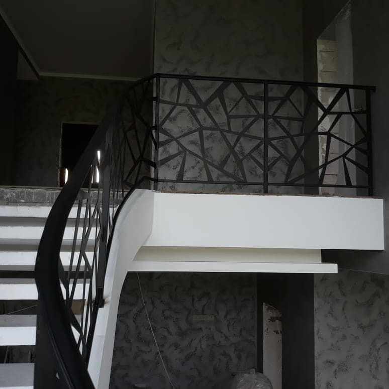 This is an example of a large contemporary concrete curved staircase in Moscow with metal railing.