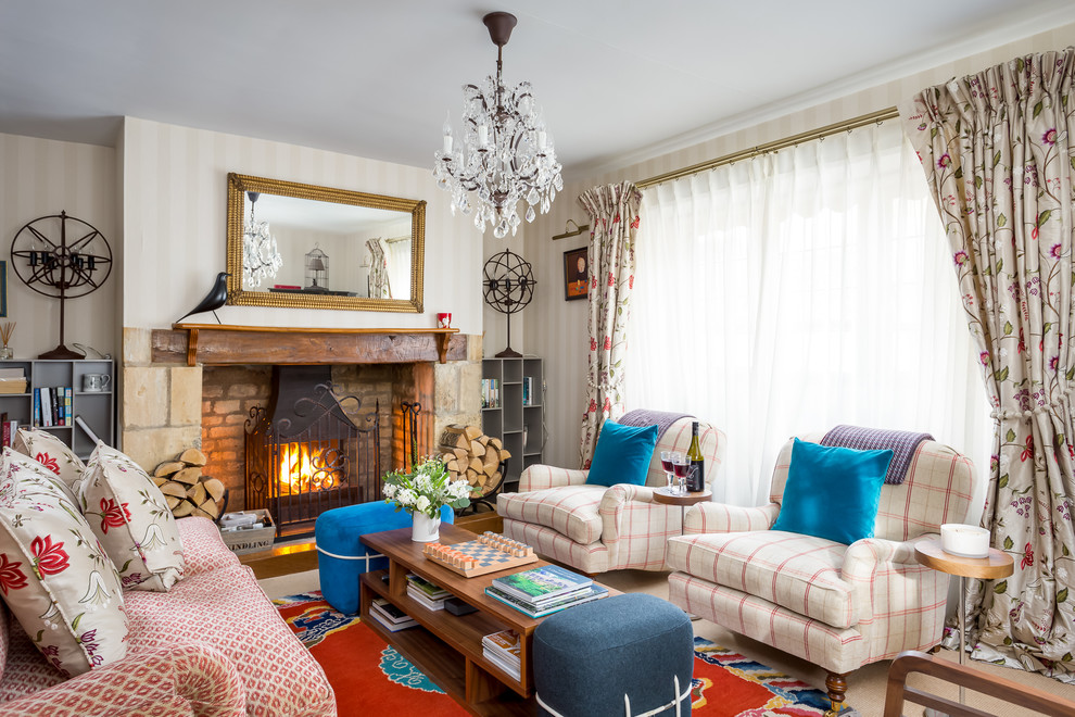 Inspiration for a mid-sized eclectic formal open concept living room in Gloucestershire with carpet, a wood stove, a brick fireplace surround and a concealed tv.