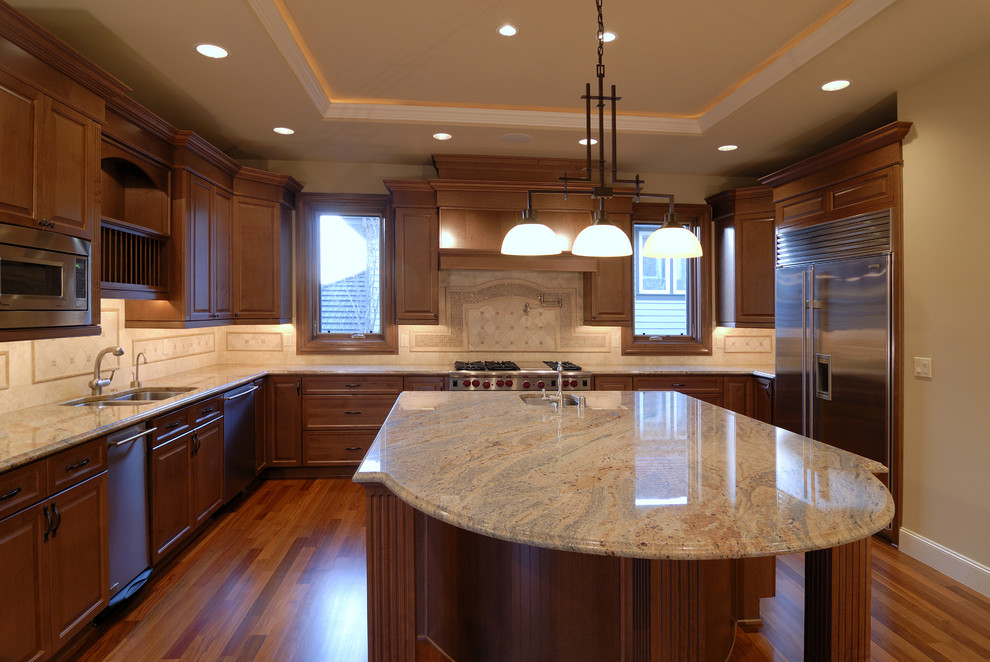 Inspiration for a large transitional u-shaped dark wood floor and brown floor eat-in kitchen remodel in Detroit with a drop-in sink, flat-panel cabinets, brown cabinets, granite countertops, beige backsplash, mosaic tile backsplash, stainless steel appliances and an island