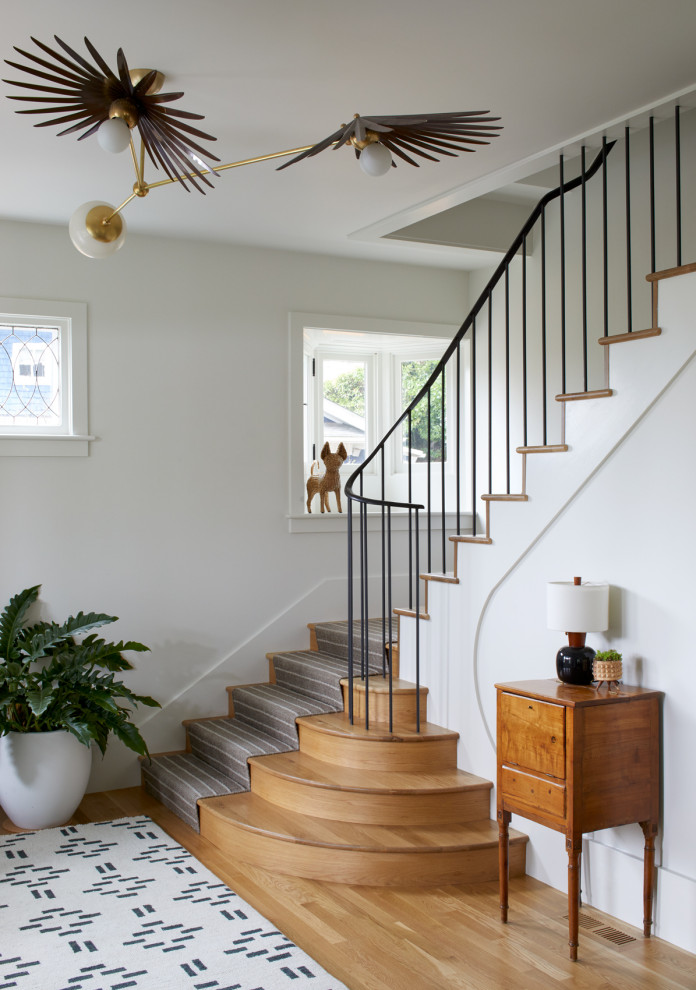 Inspiration for a traditional wood l-shaped staircase in Portland with wood risers and metal railing.