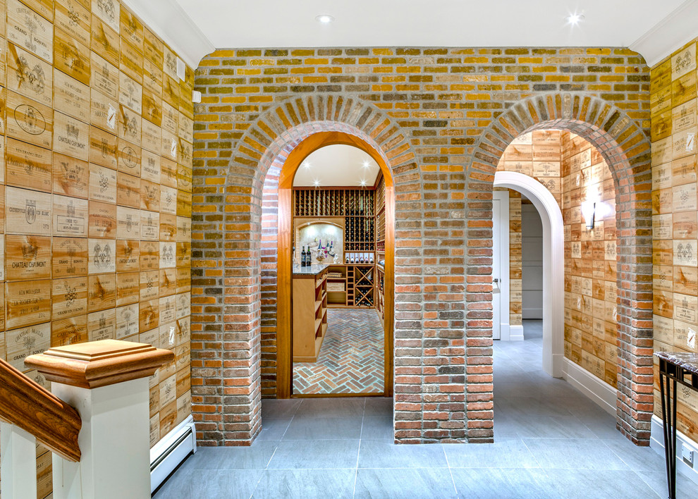 Photo of a large traditional wine cellar in Boston with storage racks and terra-cotta floors.
