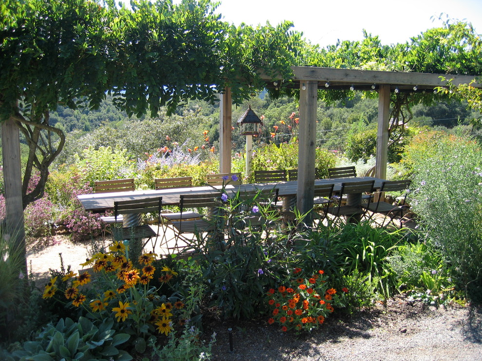 This is an example of a country patio in San Francisco with a pergola.
