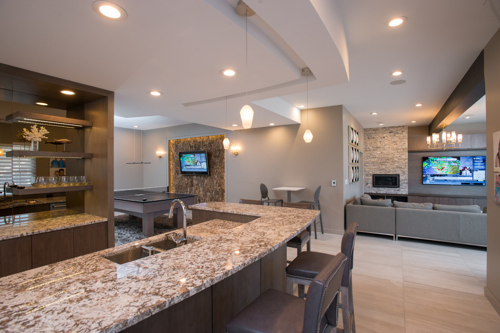 Large modern l-shaped seated home bar in Other with an undermount sink, flat-panel cabinets, medium wood cabinets, granite benchtops and beige floor.