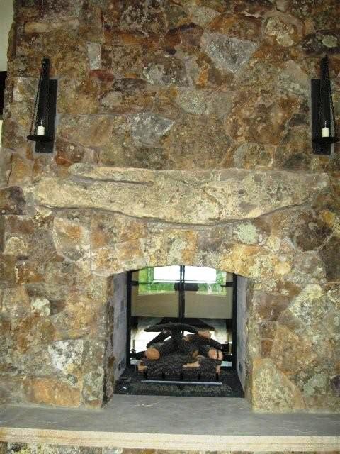 Example of a mountain style home design design in Denver