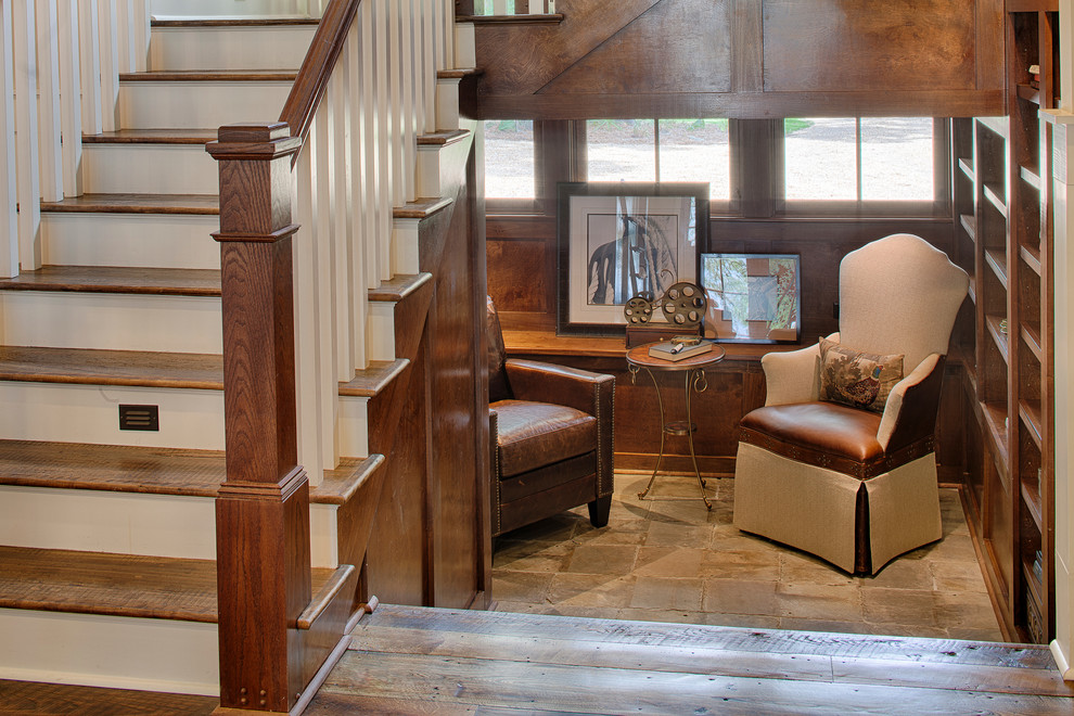 This is an example of a mid-sized traditional wood u-shaped staircase in Charlotte with painted wood risers.
