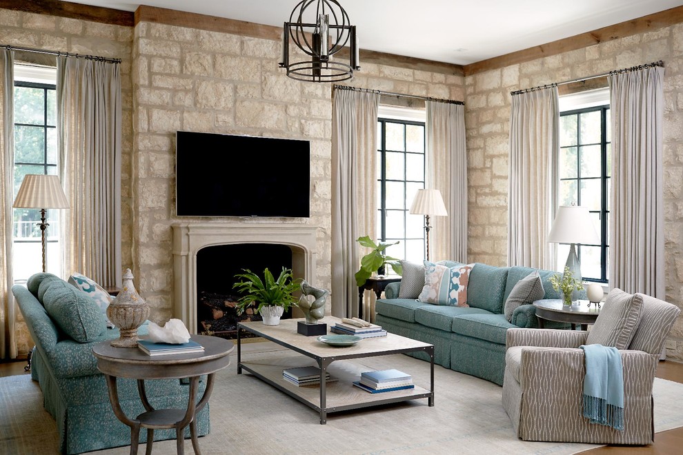 Traditional family room in Other with a standard fireplace and a wall-mounted tv.
