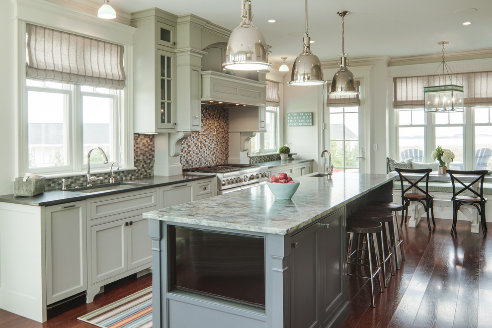 Inspiration for a large traditional eat-in kitchen in Portland Maine with an undermount sink, marble benchtops, stainless steel appliances, with island, beaded inset cabinets, grey cabinets, multi-coloured splashback, mosaic tile splashback, dark hardwood floors and brown floor.