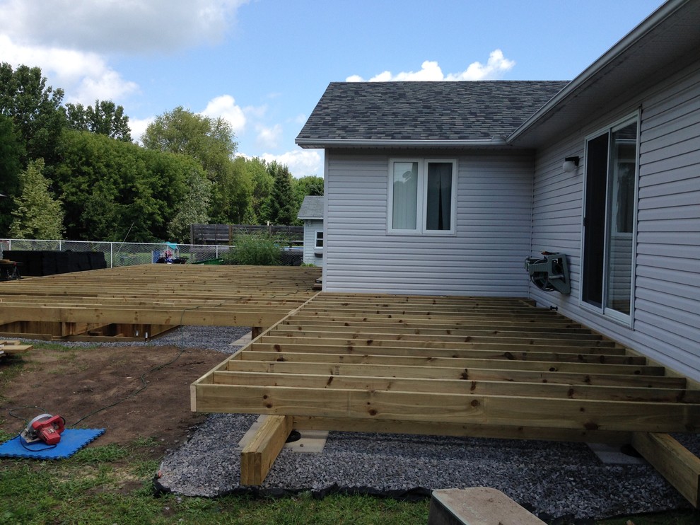 Example of a huge transitional backyard deck design