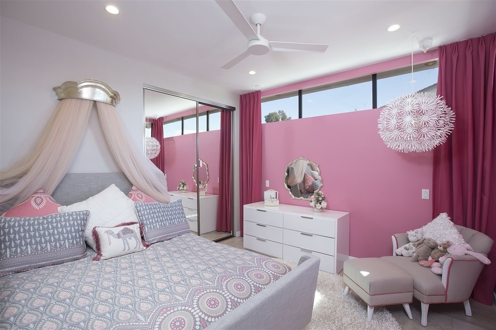 This is an example of a mid-sized contemporary kids' bedroom for kids 4-10 years old and girls in San Diego with pink walls, ceramic floors and grey floor.