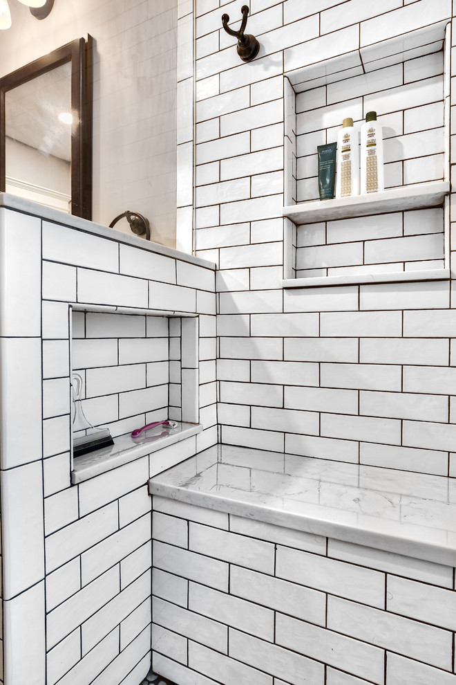 This is an example of a large country master bathroom in New York with medium wood cabinets, an alcove shower, a two-piece toilet, white tile, subway tile, grey walls, ceramic floors, a drop-in sink, granite benchtops, grey floor, a hinged shower door and white benchtops.