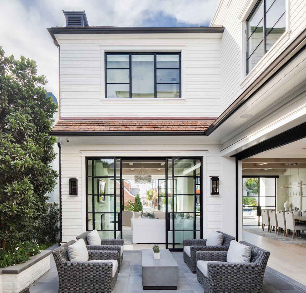 Example of a beach style home design design in Orange County