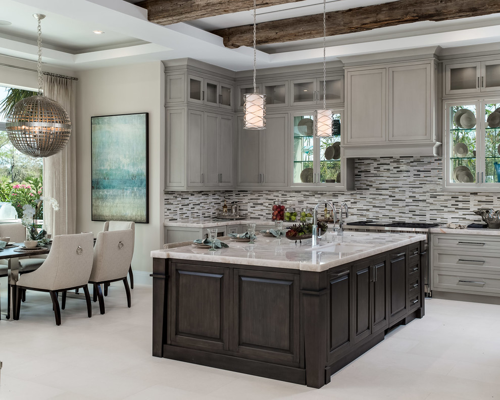 Design ideas for a large transitional l-shaped separate kitchen in Miami with an undermount sink, recessed-panel cabinets, beige cabinets, marble benchtops, multi-coloured splashback, matchstick tile splashback, stainless steel appliances, concrete floors, with island and beige floor.