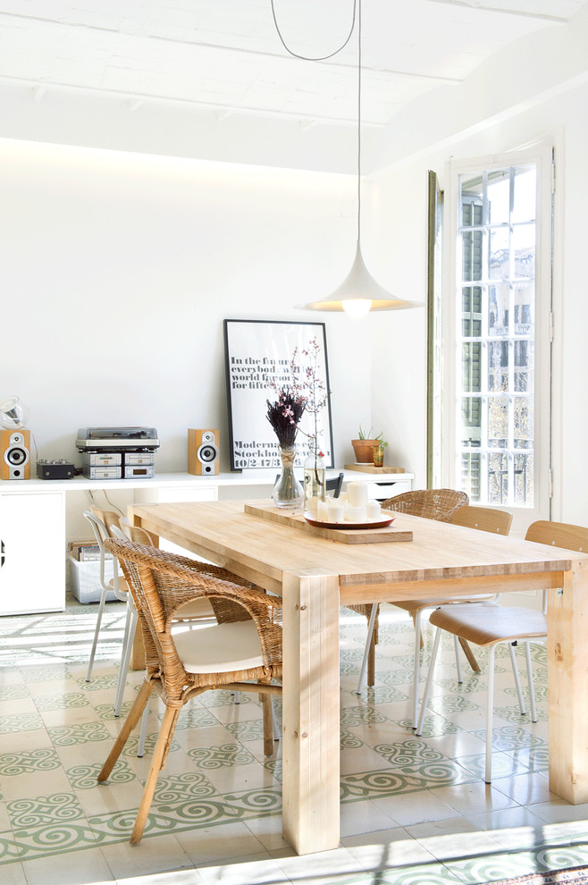 Photo of a mid-sized scandinavian open plan dining in Madrid with white walls, ceramic floors and no fireplace.