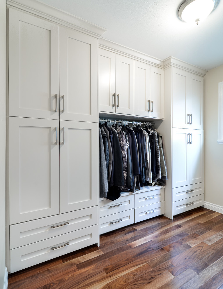 Mid-sized modern gender-neutral storage and wardrobe in Vancouver with shaker cabinets and white cabinets.