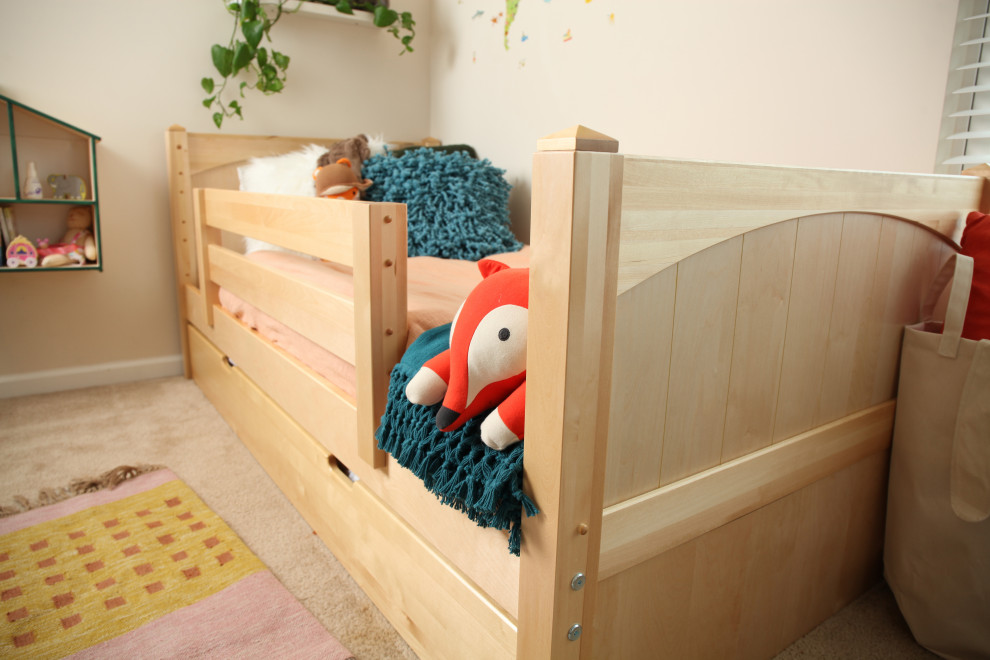 Example of a small classic gender-neutral kids' room design in Other with green walls