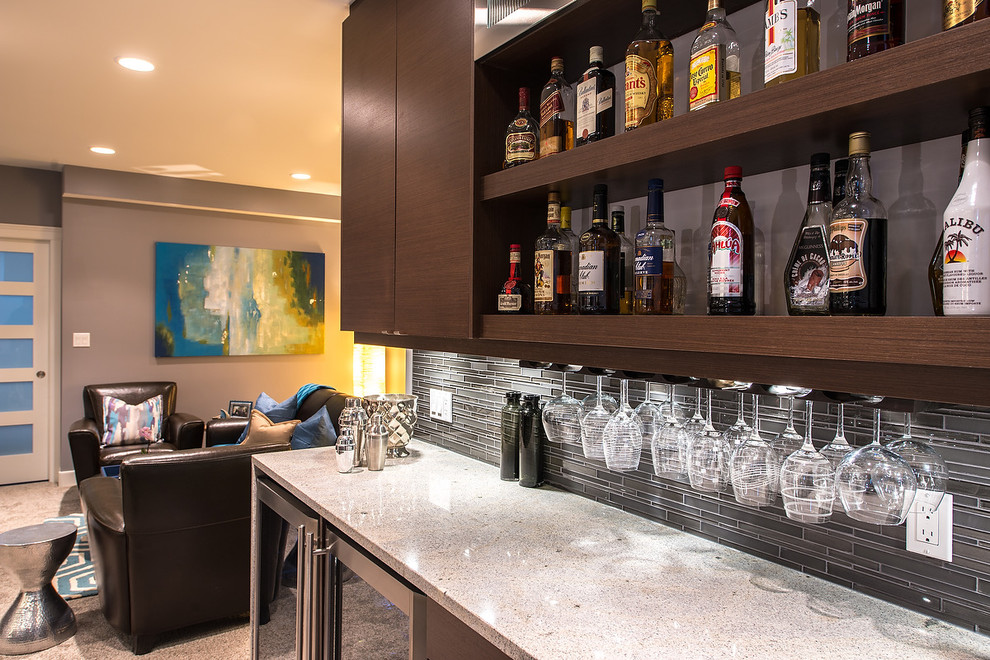 Inspiration for a modern seated home bar in Edmonton with flat-panel cabinets, brown cabinets, laminate benchtops, green splashback, glass tile splashback and linoleum floors.