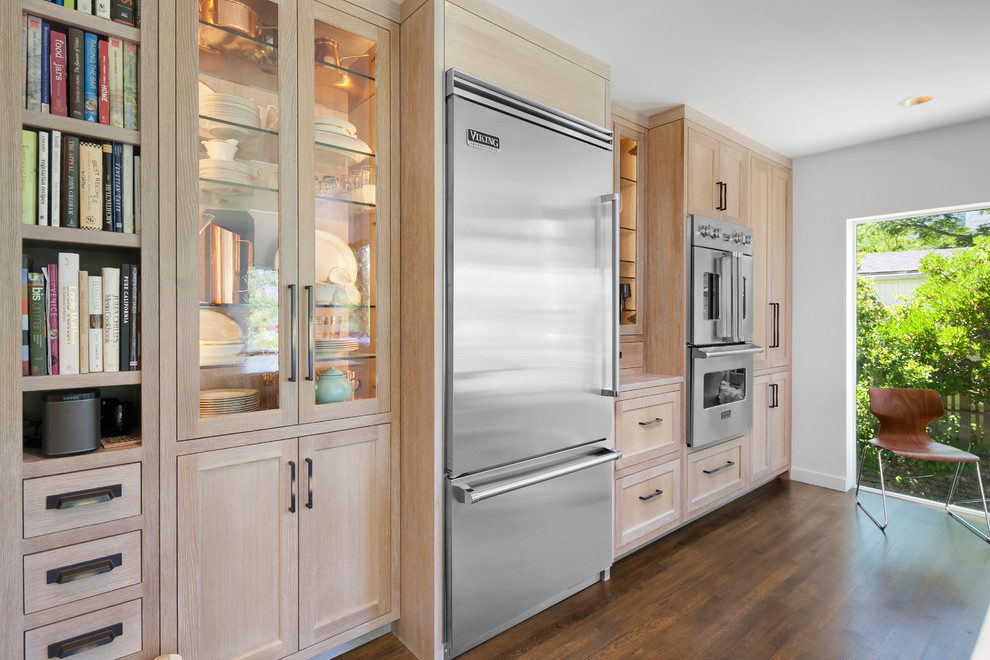 Inspiration for a large contemporary l-shaped dark wood floor and brown floor open concept kitchen remodel in Seattle with an undermount sink, recessed-panel cabinets, light wood cabinets, marble countertops, gray backsplash, cement tile backsplash, stainless steel appliances and an island
