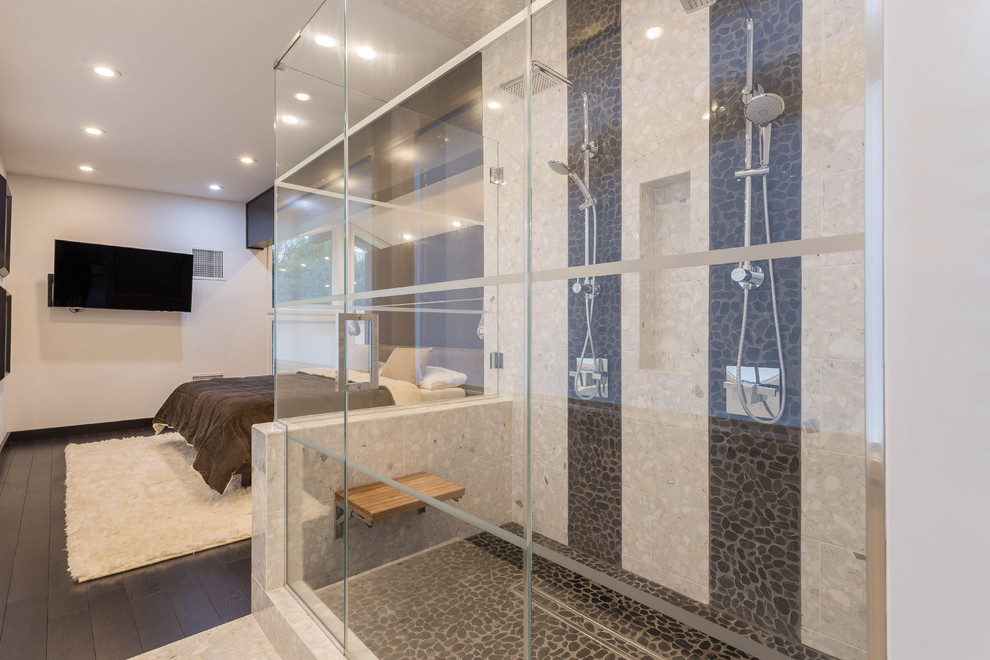 Mid-sized contemporary master bathroom in New York with beige walls, pebble tile floors, a double shower, beige tile, black tile and stone tile.
