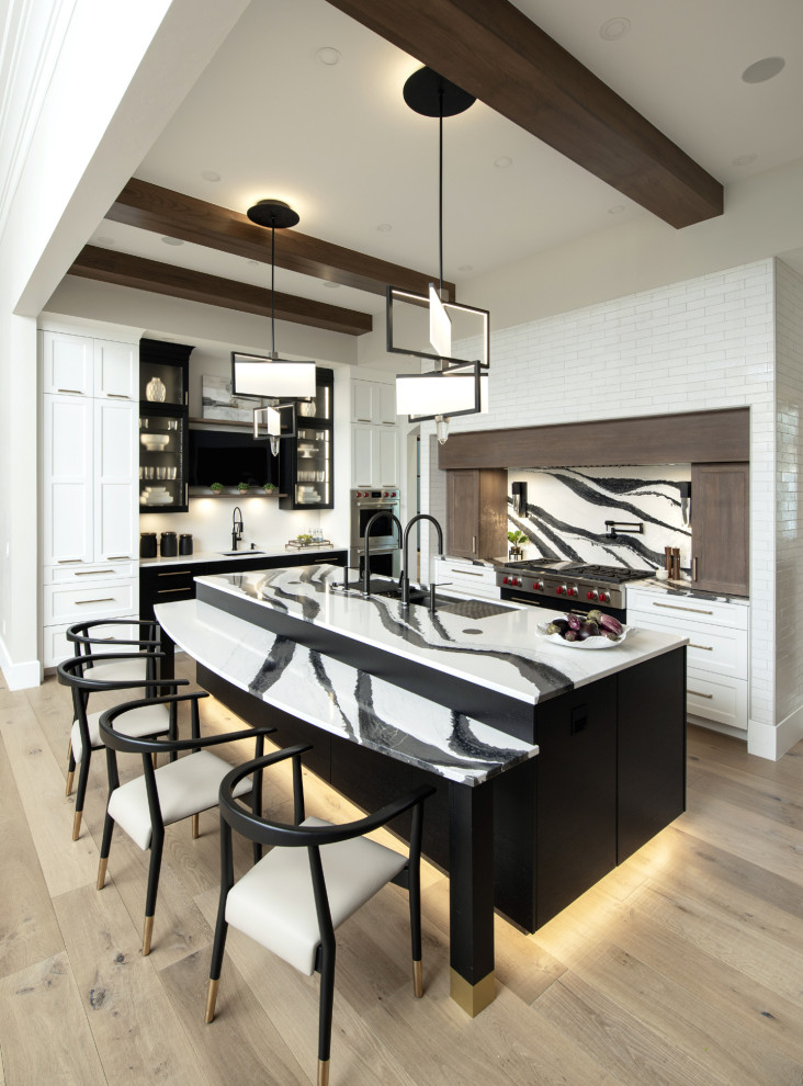 Inspiration for a mid-sized transitional u-shaped light wood floor and exposed beam open concept kitchen remodel in Oklahoma City with an undermount sink, shaker cabinets, quartz countertops, multicolored backsplash, quartz backsplash, stainless steel appliances, an island and multicolored countertops