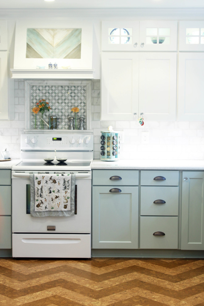 Inspiration for a country l-shaped eat-in kitchen in Raleigh with a farmhouse sink, recessed-panel cabinets, blue cabinets, quartz benchtops, white splashback, subway tile splashback and white appliances.