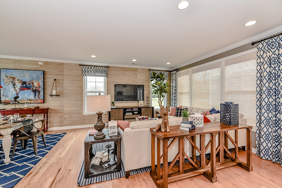 Example of a small cottage open concept light wood floor family room design in Charlotte with multicolored walls, no fireplace and a wall-mounted tv